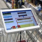 A tablet mounted on the shopping cart guides shoppers around the store