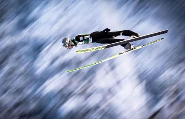 Ski jumper wearing NFC tagged ski suit